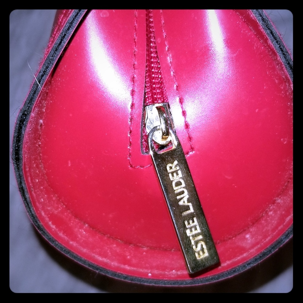 Used Red Estee Lauder makeup clutch
